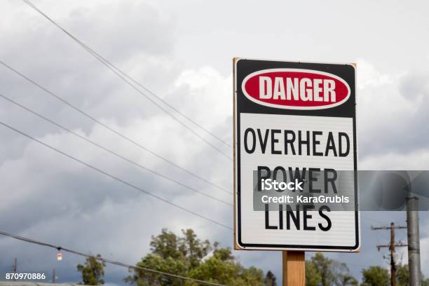 Danger Overhead Power Lines Sign Stock Photo - Download Image Now - Power Line, Above, Directly Above