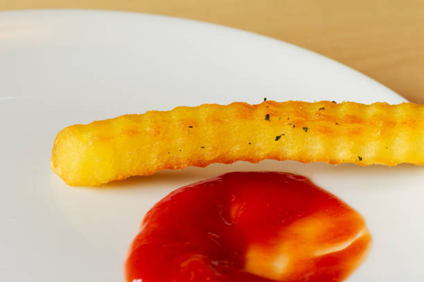 istock fried potato in chili sauce in dish on table 870970992