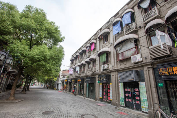 A local residential building. The local residents are living at the upper floor of the building, and the small business are at the first floor of the building.