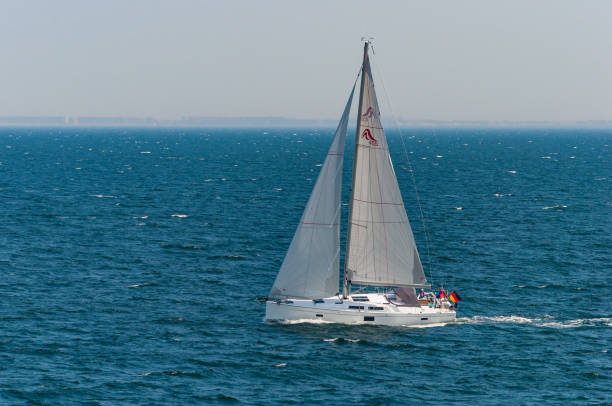 Rostock Germany - May 6. 2016: German sailboat leaving city of Rostock for sail on a spring day