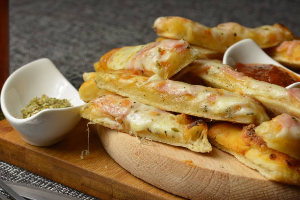 istock Pork cutlets wrapped in bacon, stuffed with cheese 870974596