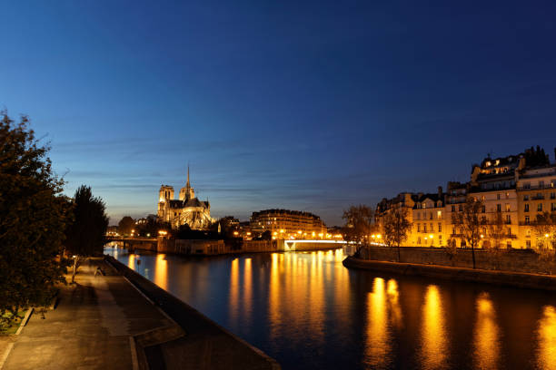 istock Notre dame de Paris from behind by night 870978418