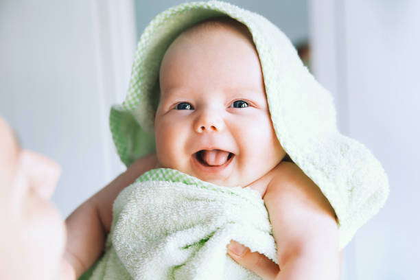 istock Little cutest baby after bath with towel on head. 870982044