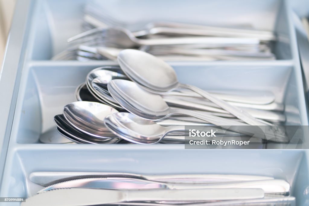 Knives forks and spoons arranged in a cutlery drawer Knives forks and spoons arranged in a domestic cutlery drawer Drawer Stock Photo