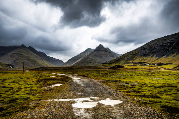 istock Icelandic Landscape with fog mountains and path leading towards 871006320