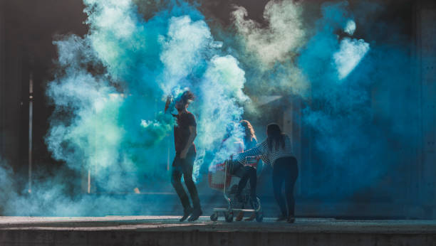 istock Teenagers having fun with smoke bombs 871009184
