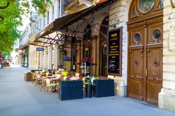 A street cafe is in Budapest, Hungary. There are many cozy cafes for tourists. A lot of them has summer ground.