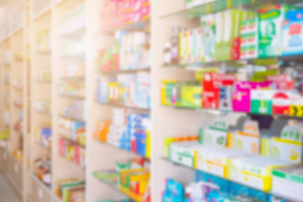 Medicines on pharmacy shelves blurred background Medicines on pharmacy store shelves blurred background over the counter meds stock pictures, royalty-free photos & images