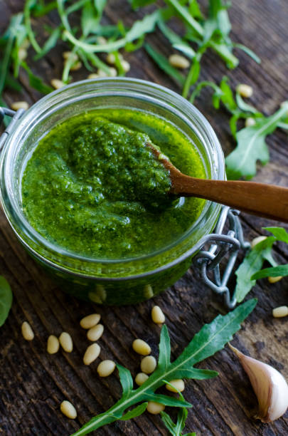 istock Homemade arugula pesto in a glass jar 871012252