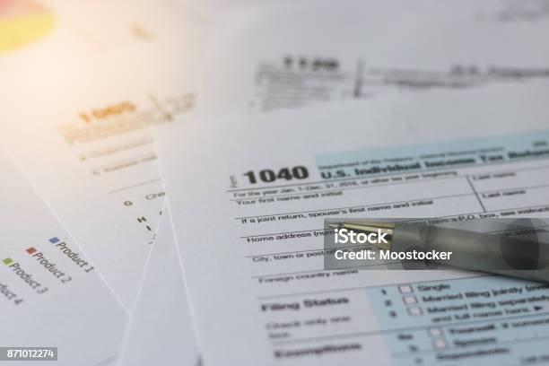 Selective Focus A Pen On Us Tax Form 1040 On Top For Background Taxation Concept Stock Photo - Download Image Now