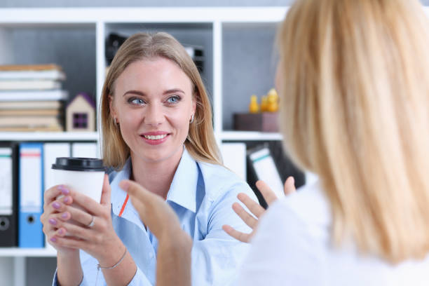 istock Smiling business woman drinking coffee 871012488