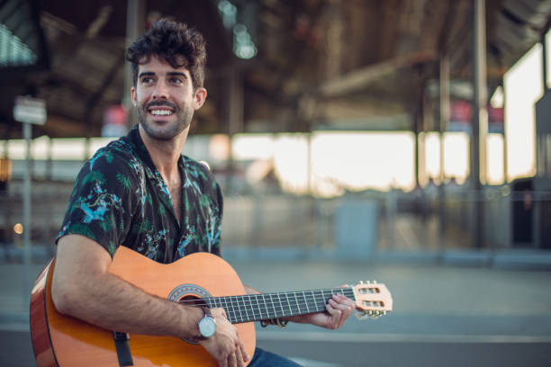 istock Playing guitar on the street 871022048