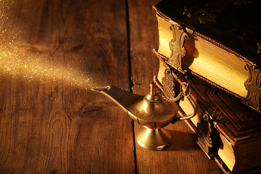 Image of magical aladdin lamp with glitter smoke. Lamp of wishes