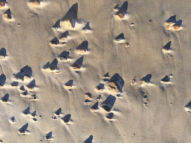 istock Beach stones and shadows close up 871031000