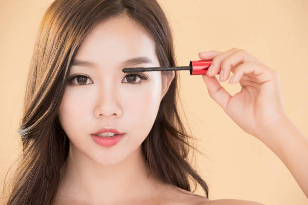 woman take makeup brush beauty asia skincare woman take mascara brush asian eyebrows stock pictures, royalty-free photos & images