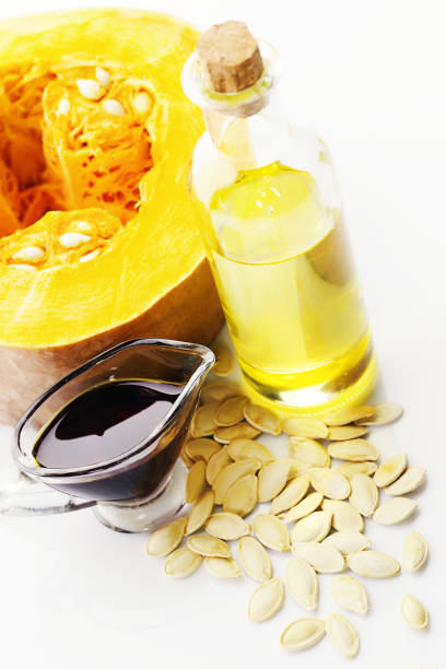 istock Pumpkin and oil made from pumpkin seeds 871031222