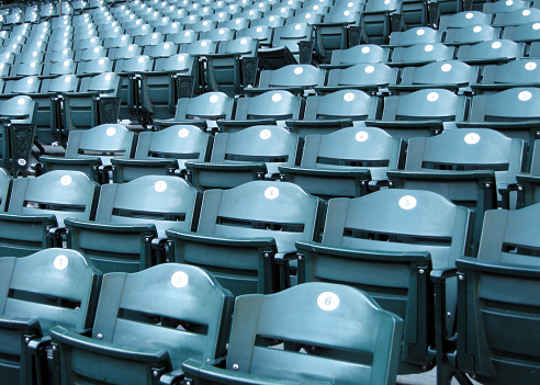 Closeup of empty seats at a baseball stadium.