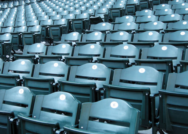 Baseball Stadium Seating Closeup of empty seats at a baseball stadium. baseball stadium chairs stock pictures, royalty-free photos & images