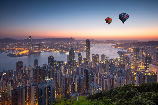 Hot air balloon flying over Hong Kong island