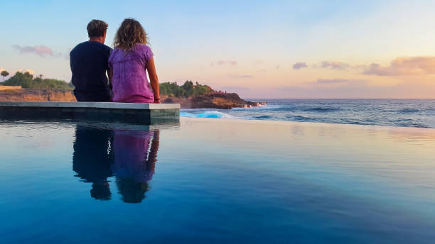 istock Romantic couple on sunset beach 871050594