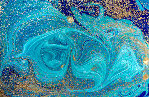 istock Marbled blue abstract background with golden sequins. Liquid marble ink pattern. 871053060