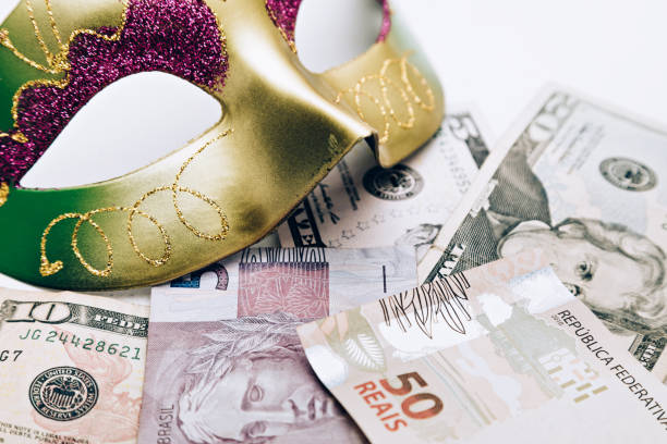 Carnival mask with Dollar and Real Carnival mask with American and Brazilian money mardi gras body painting stock pictures, royalty-free photos & images