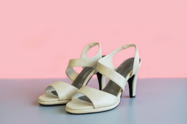 istock Biege high heel on color background 871063614