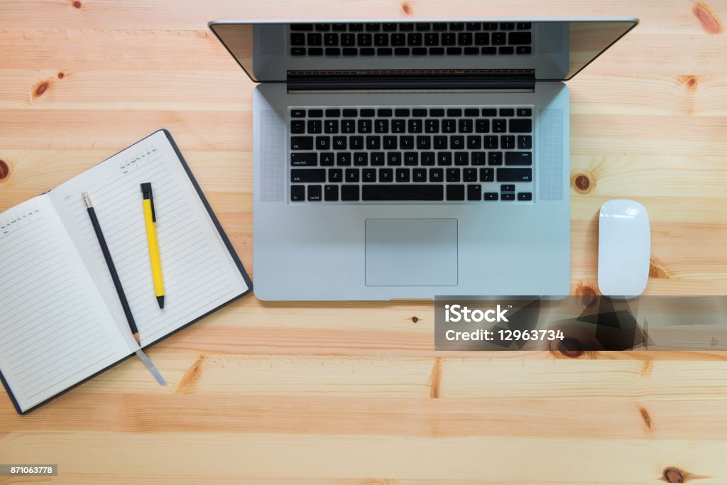 Computer laptop and diary note on table, Top view, Technology concept Computer laptop and diary note on table., Top view, Technology concept Above Stock Photo