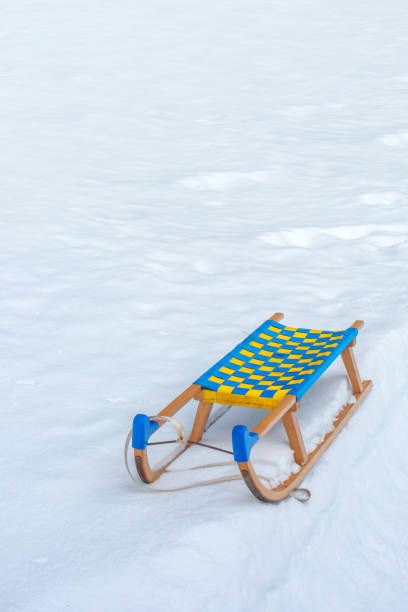 istock Wooden sledge in winter snow 871070976
