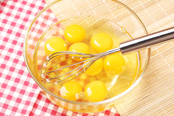 istock Whisk for whipping and eggs in bowl  on Plaid tablecloth 871071214
