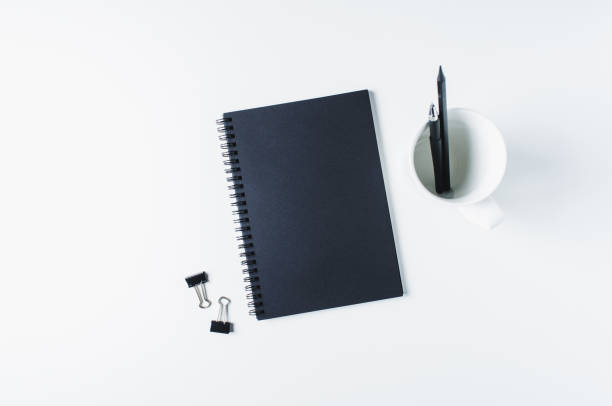 istock Sketchbook, pencils and office supplies on white background 871072300