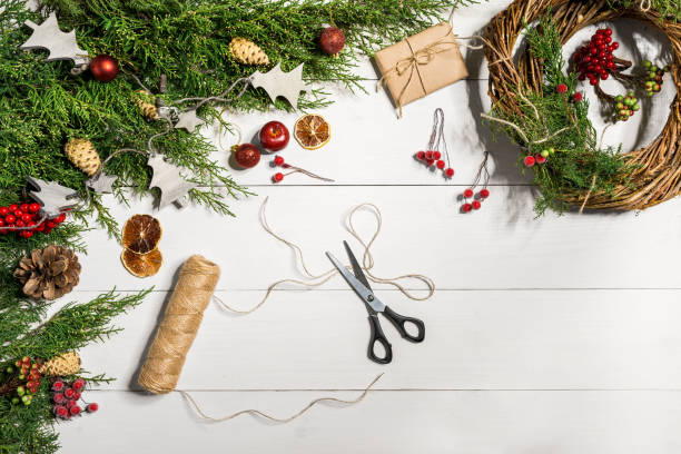 istock How to make christmas door wreath. The working process. The decorator's workplace. Top view 871072410