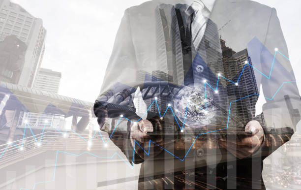 Double exposure of success businessman using digital tablet with city landscape background.Forex graph oon the business city centre. A metaphor of international financial consulting.investment concept with the small world (Elements of this image furnished by NASA) doble exposición de empresario de éxito con tableta digital con fondo de paisaje de la ciudad. forex gráfico oon el centro de la ciudad de negocios. una metáfora del concepto de consulting.investment financiera internacional con el pequeño mundo (os de esta imagen amueblado