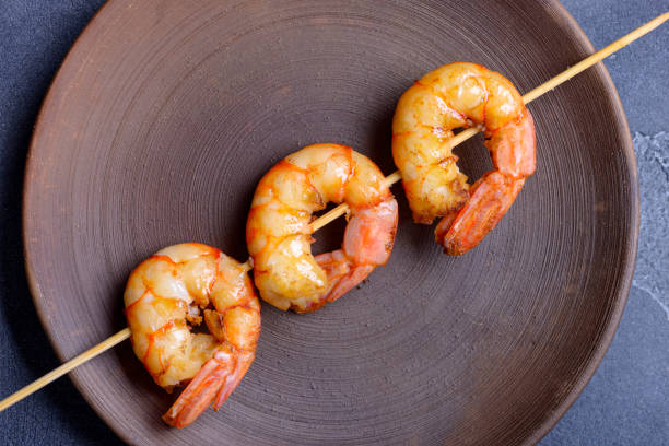 istock Tiger shrimp on skewer in plate 871077978