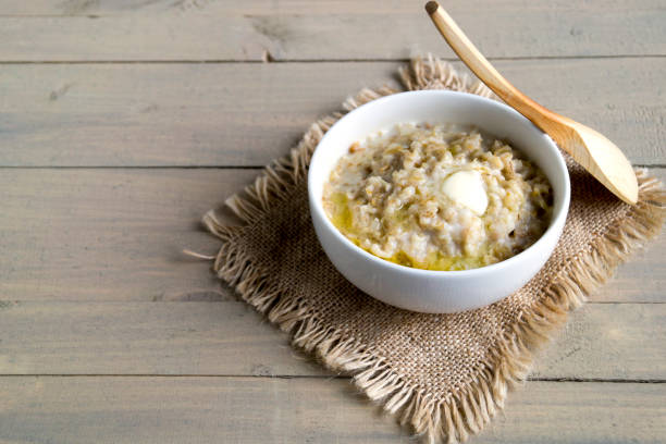 istock Breakfast with oatmeal and fresh raspberries. 871078818