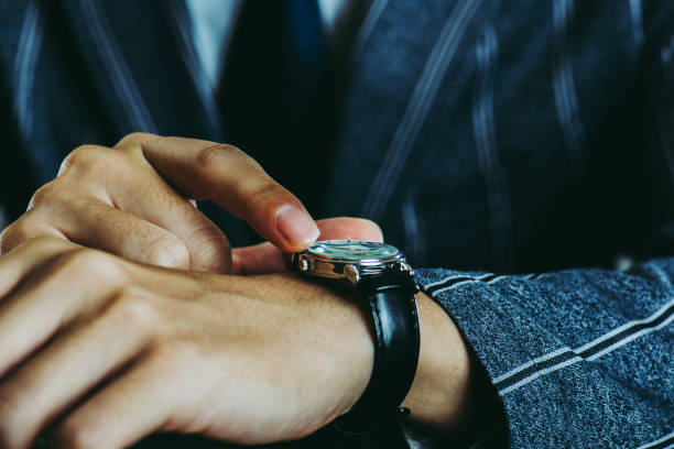 istock Male arm wearing a wrist watch 871082810