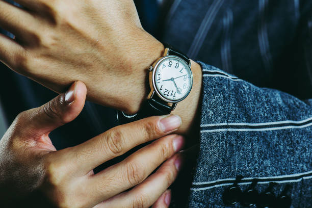 istock Male arm wearing a wrist watch 871082890