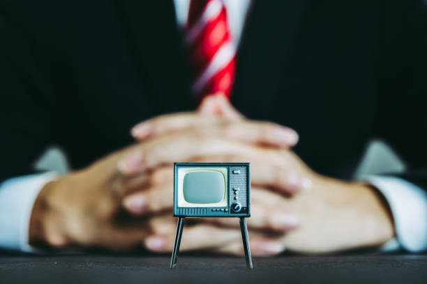 istock Television and businessman 871085342