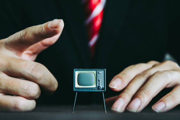 istock Television and businessman 871085378