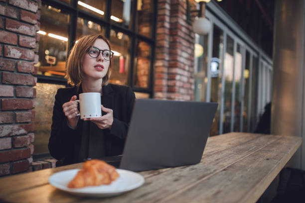 istock Young woman working in the cafe 871085828