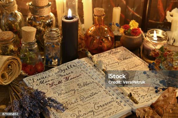 Magic Book With Spells Lavender Bunch And Black Candle Stock Photo - Download Image Now