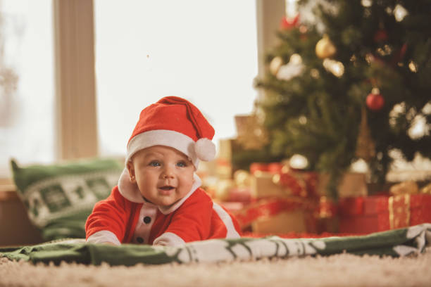istock Baby in a Santa Claus costume 871086384