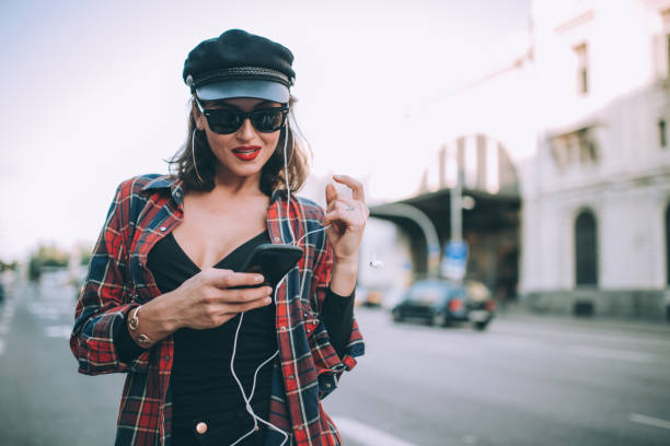 istock Attractive woman walking down the street 871091536