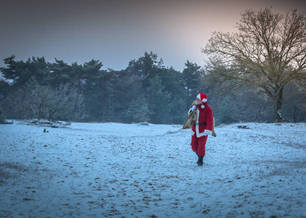 istock unhurried Santa Claus coming from forest 871094688