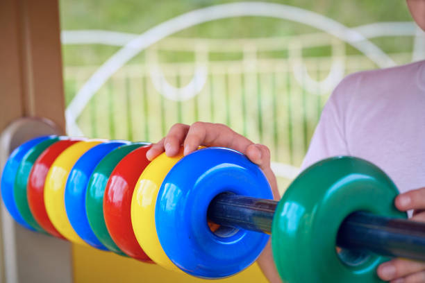 istock Cute toddler boy having fun on playground. Active outdoors game for little children 871098596