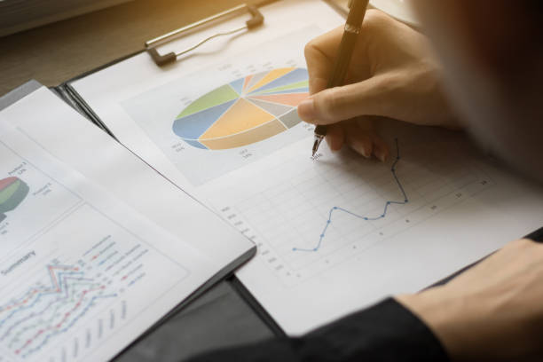 istock Business people hand writing on business report 871102628