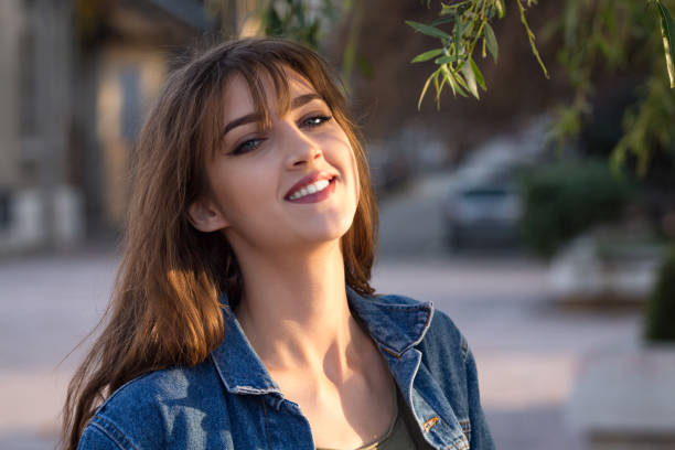 lifestyle shot of teenager girl enjoying day in park.