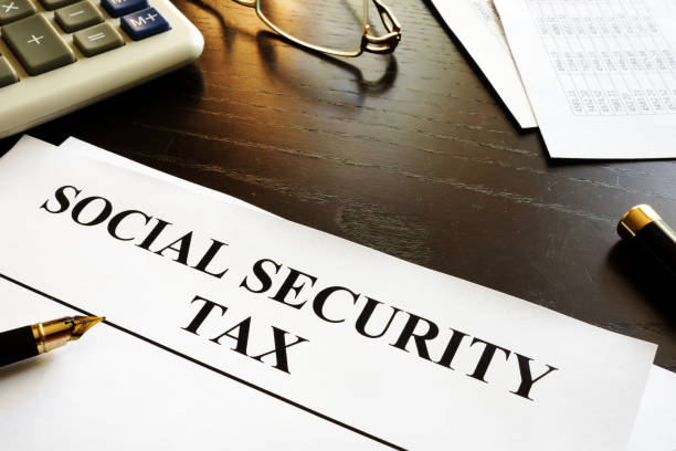 istock Papers with title social security tax. 871106586