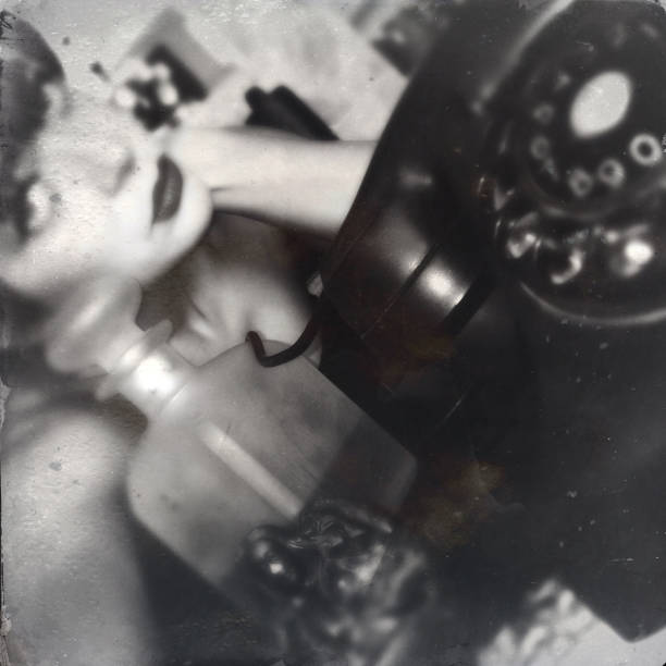 istock Young Woman With Old Telephone 871108848