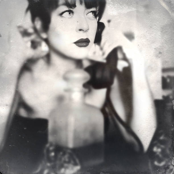istock Young Woman With Old Telephone 871108854